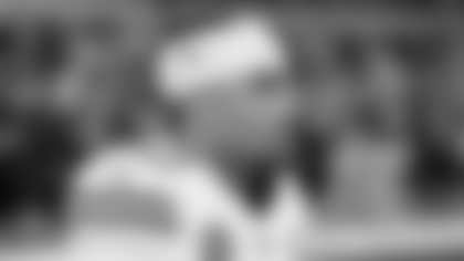 Kansas City Chiefs players on the field warming up prior to a Week 13 matchup against the Dallas Cowboys.